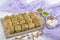 Turkish Midye Baklava  Mussel Shape Baklava  with green pistachio Powder and Butter Cream. Famous Turkish Gaziantep baklava