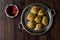 Turkish Midye Baklava Mussel Shape Baklawa with green pistachio Powder, Butter Cream and Traditional Tea in Silver Tray.