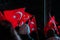 Turkish people waving flags in a celebration of national days at night
