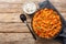 Turkish pilaf from bulgur with vegetables and spices close-up in a bowl. Horizontal top view