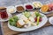 Turkish style breakfast; Traditional Turkish breakfast platter on the table, top view. Healthy Turkish breakfast in the bright