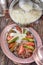 Turkish traditional buttery iskender kebab with yoghurt in the copper plate