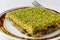 Turkish Traditional Dessert Kadayif with Pistachio Powder.