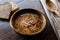 Turkish Traditional Vermicelli Soup in a wooden bowl / Tel sehriye corbasi.