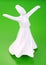 Turkish traditional whirling derwish on green background