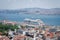 Turkish white 9-storey cruise ship standing in the Bosphorus Strait on the pier, on the background of another island