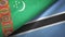 Turkmenistan and Botswana two flags textile cloth, fabric texture