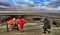 Turkmenistan, Darvaza - March 21, 2019: Girls make a photo on the background of the burning crater