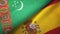 Turkmenistan and Spain two flags textile cloth, fabric texture