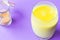 Turmeric with Coconut Milk Drinks and Ghee on Purple Background Good for Beauty and Health, Gives a lot of Energy, Close-up