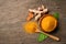 Turmeric curcumin powder in wooden bowl and spoon