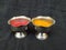 Turmeric and Kumkum Cup  on Black Background