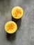 Turmeric lassi (orange smoothie) garnished with turmeric in two glasses