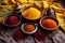 turmeric, paprika, and saffron threads in bowls