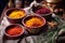 turmeric, paprika, and saffron threads in bowls