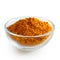 Turmeric powder in glass bowl.