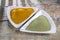 Turmeric powder and moringa in bowl on wooden table,