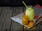 Turmeric powder, paste and latte on wooden background. Ayurvedic healthy golden drink with coconut milk and ghee for beauty