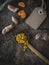 Turmeric powder and rhizome on wooden ladle. Overhead of vintage wooden table