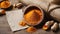 Turmeric powder in a wooden bowl on a wooden table