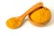Turmeric powder in wooden spoon and bowl on the white background closeup isolated. Healing spice, health care concept