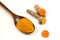 Turmeric powder in a wooden spoon and isolated turmeric roots on a white background. Turmeric helps reduce fat.