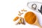 Turmeric powder in wooden spoon, tumeric root, curcumin capsule and stethoscope isolated white background.