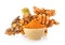 Turmeric root and dry tumeric in wood bowl