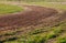 Turn of atv race track. Dust and grass