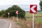 Turn signs on mountain road