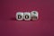 Turned cubes and changes the word don\\\'ts to does. Beautiful red background, copy space.