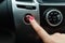 turning on car air conditioning system,finger hitting car emergency light botton