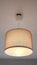 turning light on and off ceiling lamp hanging in a room ,