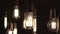 Turning light ON and OFF. Decorative antique Edison style light bulbs hanging from the ceiling