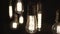 Turning light ON and OFF. Decorative antique Edison style light bulbs hanging from the celling