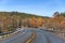 Turning Norwegian highway in autumn