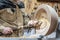 Turning wooden bowls on a lathe. The close up view of spinning the lathe machine