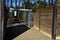 Turnstile to the field protecting against the entry of other animals. visitors enter through a barred stainless steel gate. fence,