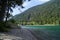 turquoise alpine lake Plansee in the scenic Austrian Alps on a sunny day in July, Austria