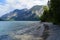 turquoise alpine lake Plansee in the scenic Austrian Alps on a sunny day in July, Austria