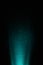 On a turquoise background in a black dot, a bright scattered ray of light