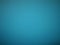 turquoise background with a light gradient. Tinted cardboard..