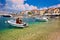 Turquoise beach and harbor of Postira village