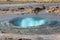 The turquoise blue boiling bubble of Strokkur Geyser before eruption. Gold Circle. Iceland.