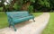 Turquoise Blue Colored Wrought Iron Bench in the Public Garden