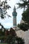 Turquoise blue historical Ottoman Anatolian Seljuk style architecture stone built mosque minaret in Turkey