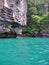 Turquoise Blue Sea and Forested Cliffs in Krabi, Thailand