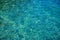 Turquoise blue tropic sea water texture. Seawater closeup photo. Idyllic sea surface. Transparent water tropical seaside