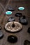 Turquoise candles with black rocks and silver pentagram with inc