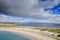 Turquoise color ocean water and warm sandy Dog`s bay beach and Gurteen bay in the background. County Galway, Ireland. Irish